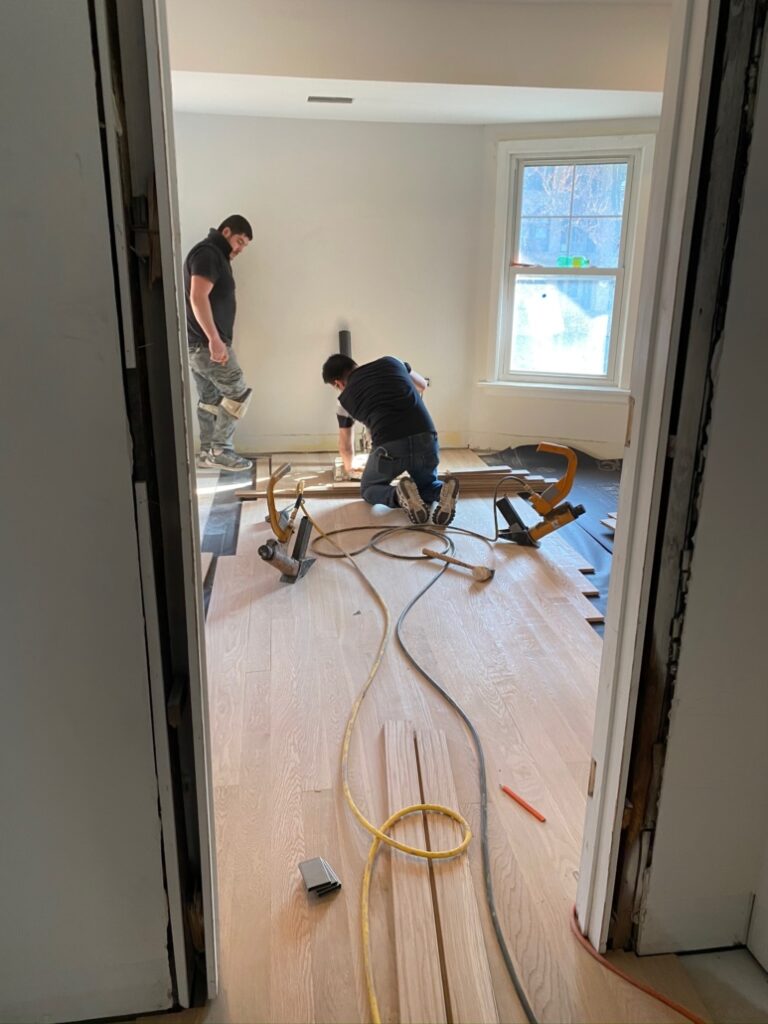 New floors being installed in the boys' room.