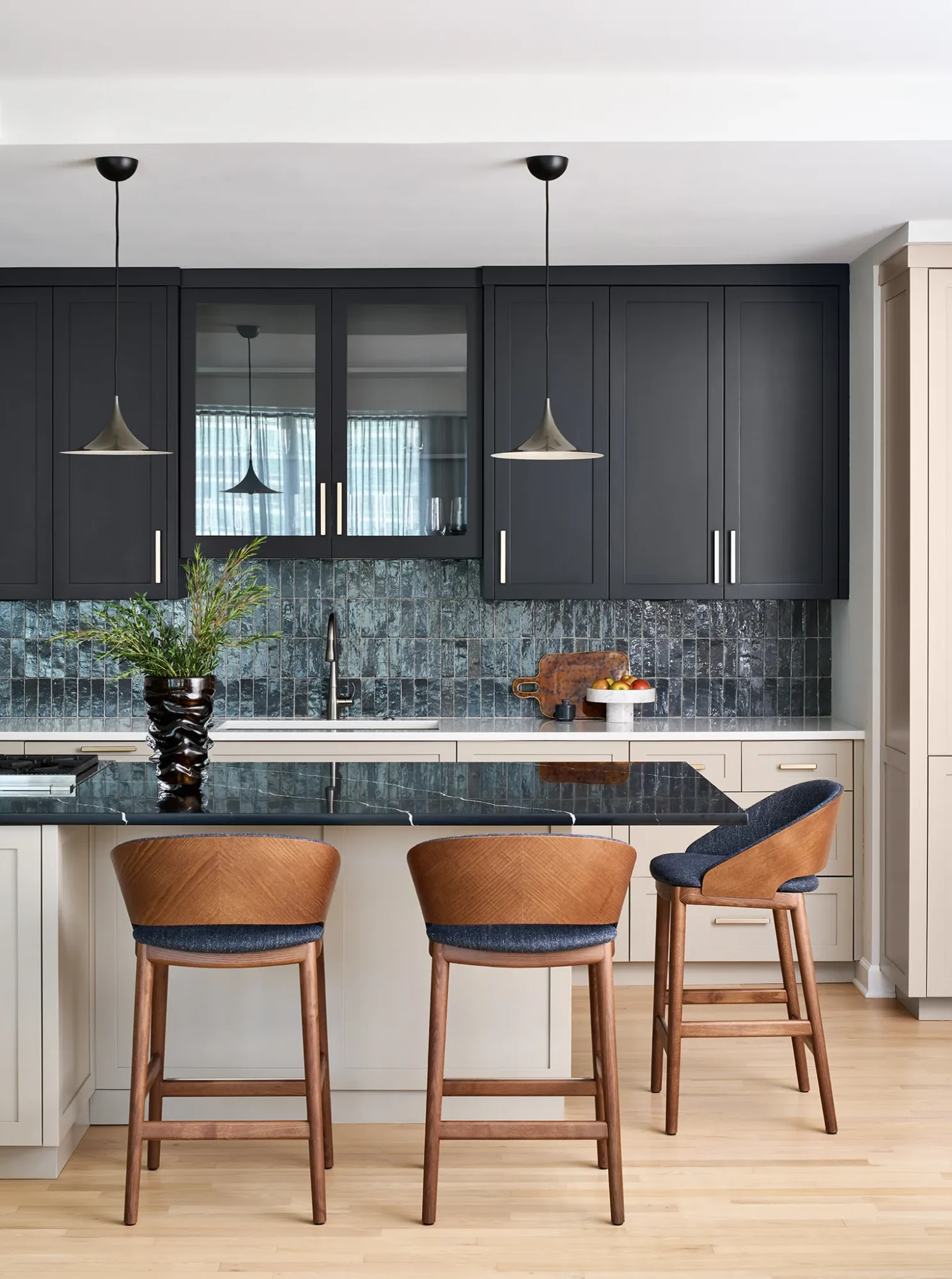 Luxury transitional kitchen in Streeterville with single-wall layout, prep island seating, vertical blue-gray tile backsplash and contrasting counters