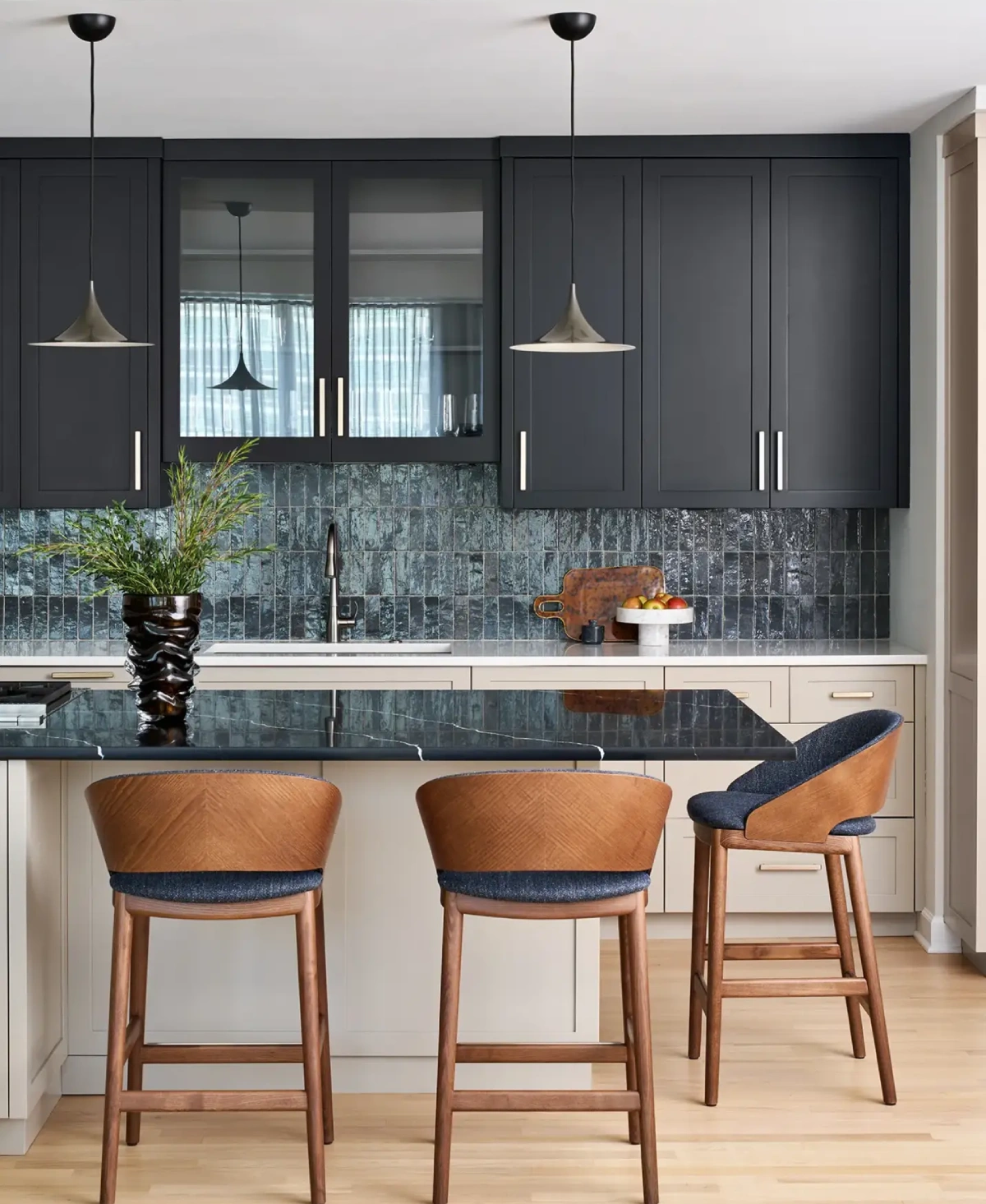 Luxury transitional kitchen in Streeterville with single-wall layout, prep island seating, vertical blue-gray tile backsplash and contrasting counters