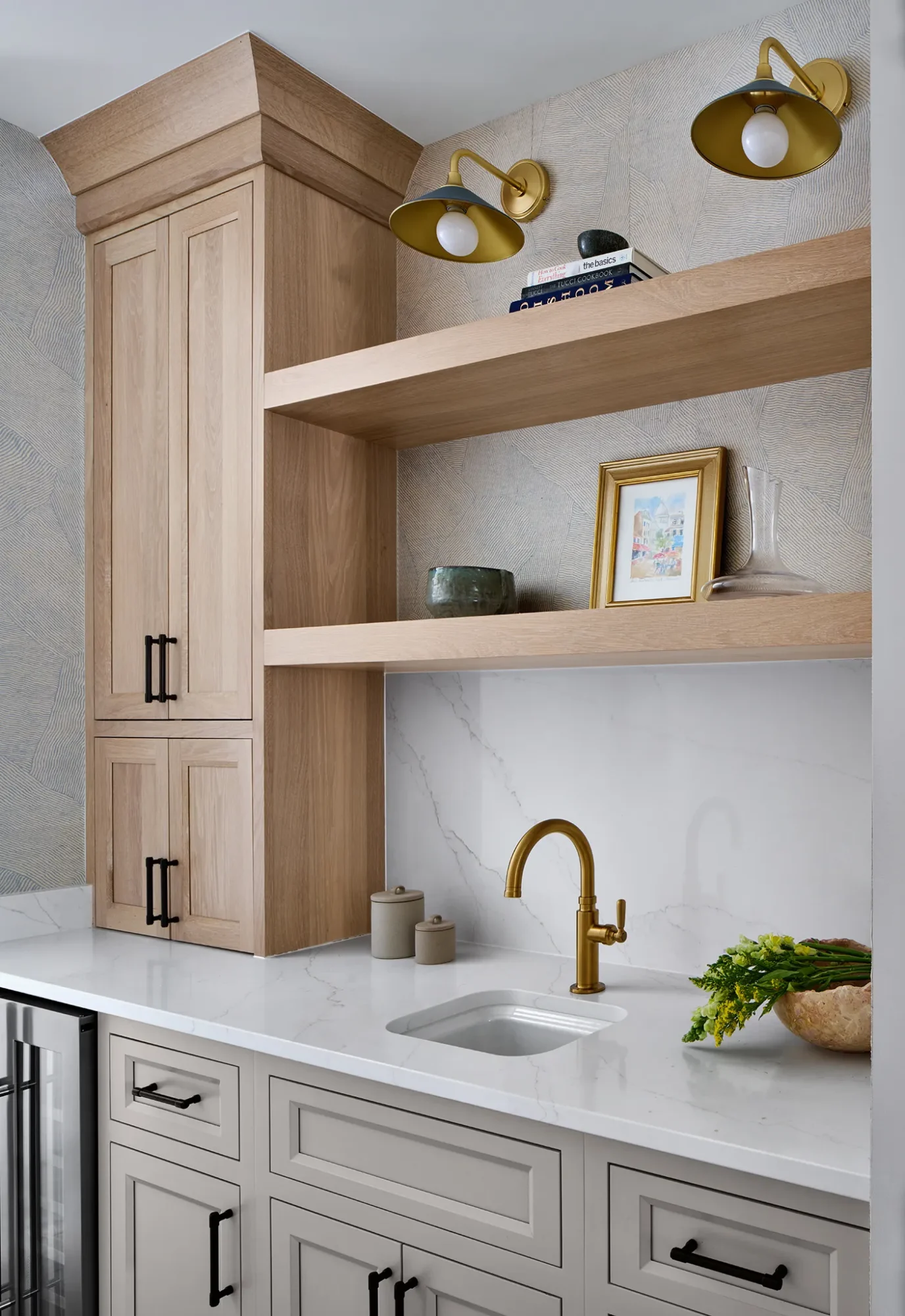 Custom butler’s pantry with white cabinetry, wood shelving, brass fixtures, and quartz countertops in a city remodel
